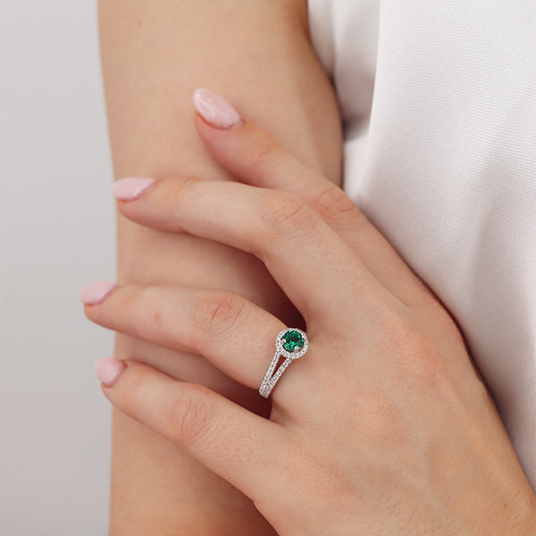 lab grown emerald engagement ring. The Lily Arkwright Amelia ring 950 platinum with a diamond halo and diamond shoulders.